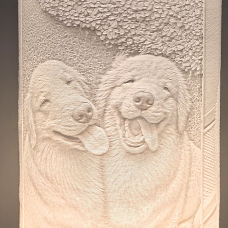 A photo sculpted as relief in a lamp shade, lit from within
