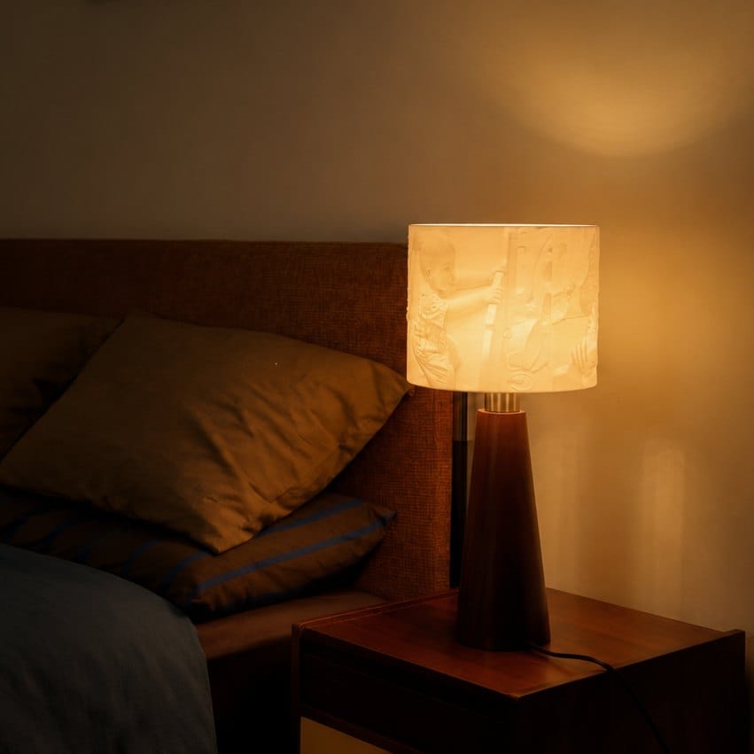 Drum lamp glowing in a bedroom