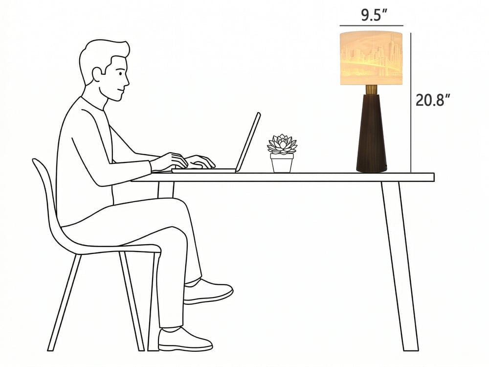 Size drawing: the Drum lamp 9.5 inches wide next to a person at a desk