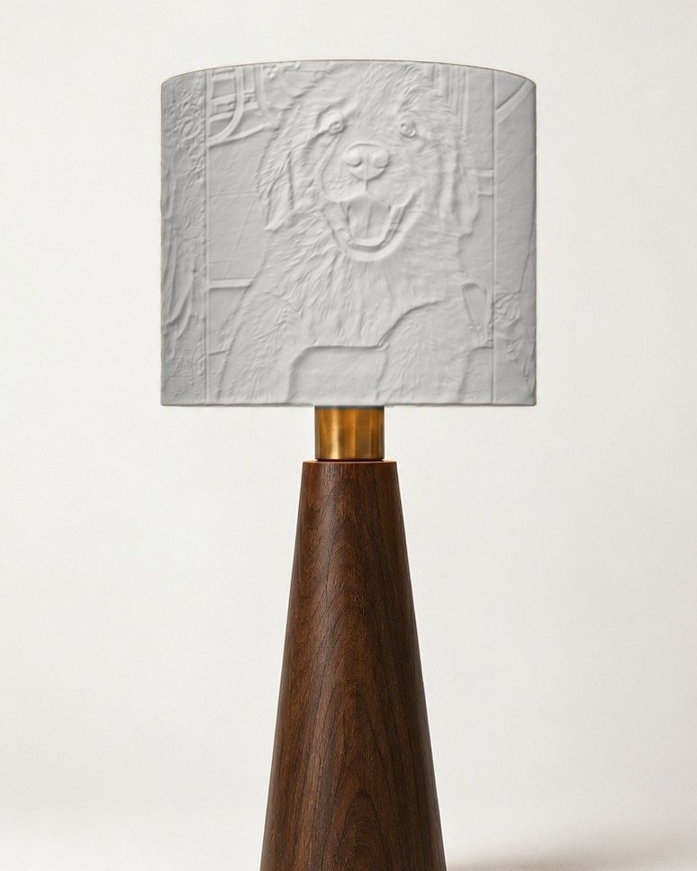 The Drum lamp switched off: the puppy portrait is a white relief on the shade
