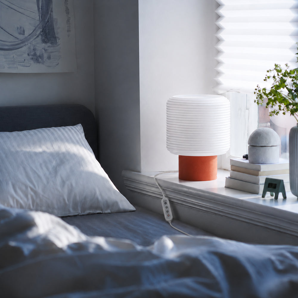 The Vortic lamp by a bedroom window in daylight